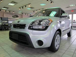 a white Kia Soul parjed inside a showroom