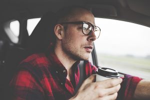 driver with coffee cup